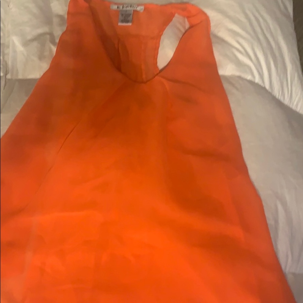Orange flowing sleeveless blouse